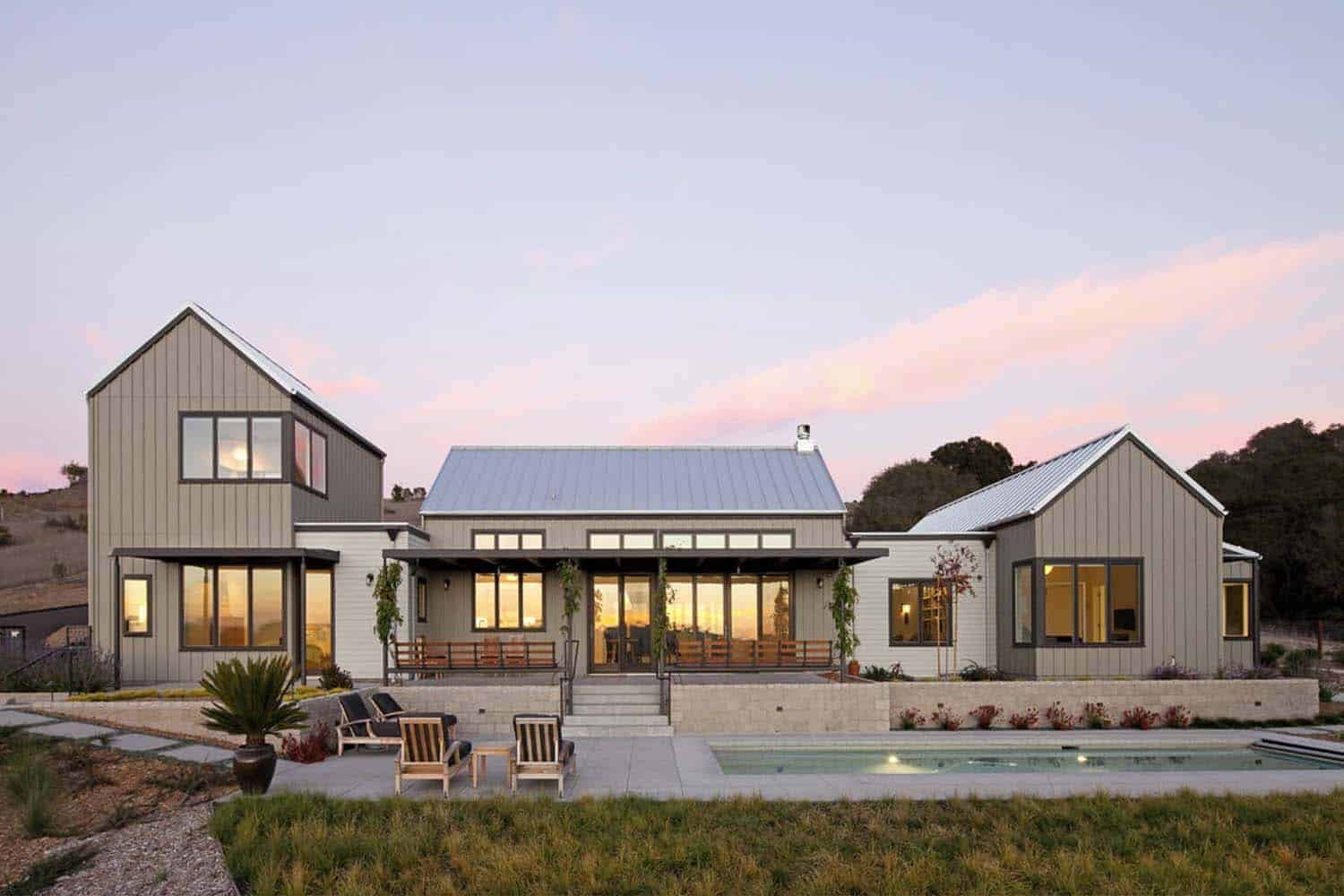 contemporary farmhouse exterior with a pool