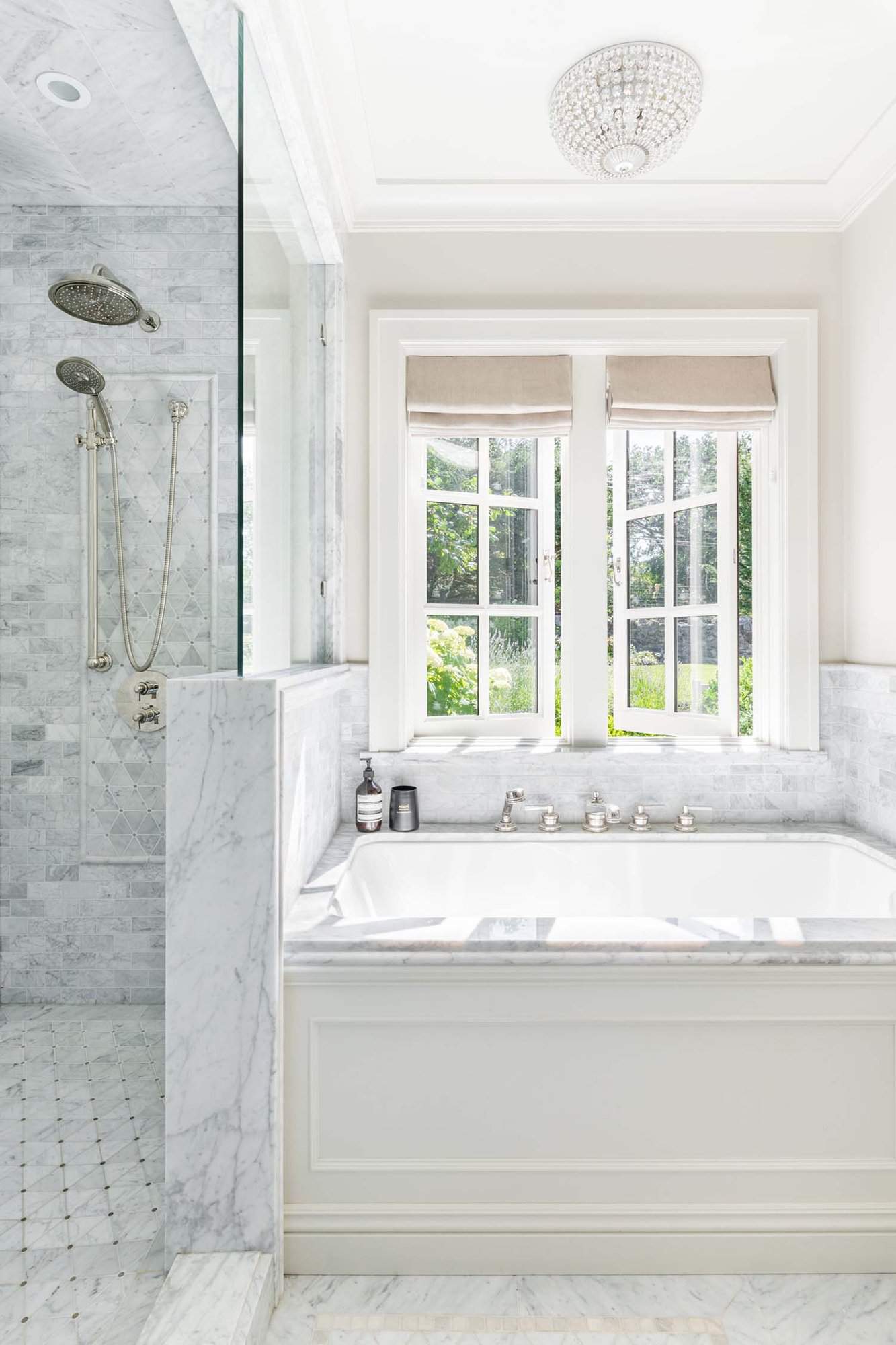 traditional bathroom with a tub and shower