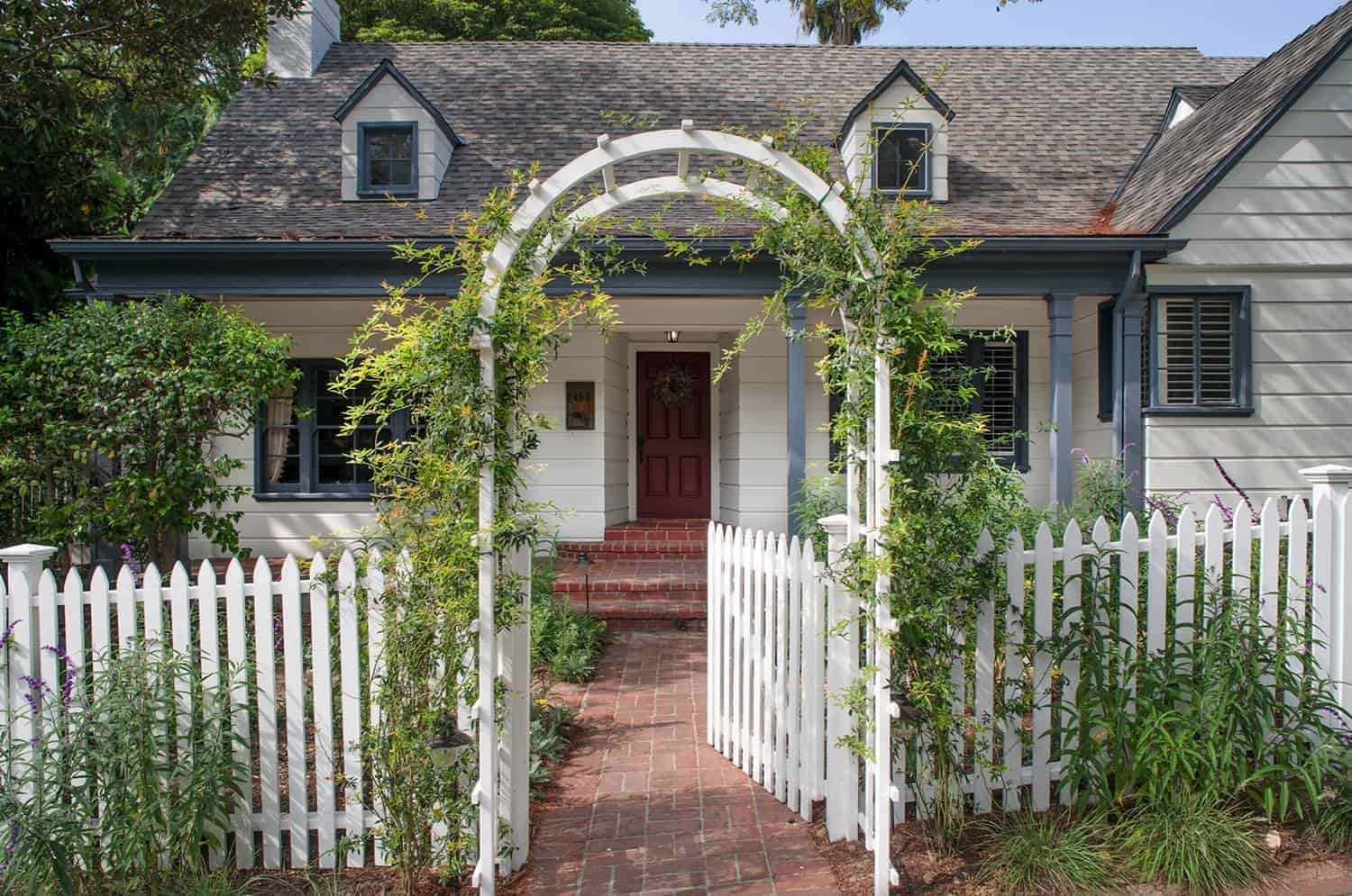 modern farmhouse style home exterior with an arbor entry into the front courtyard