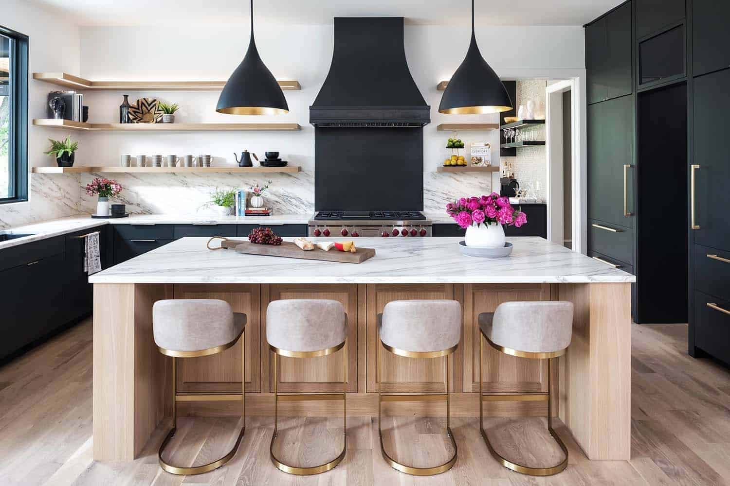 modern kitchen with large black pendants