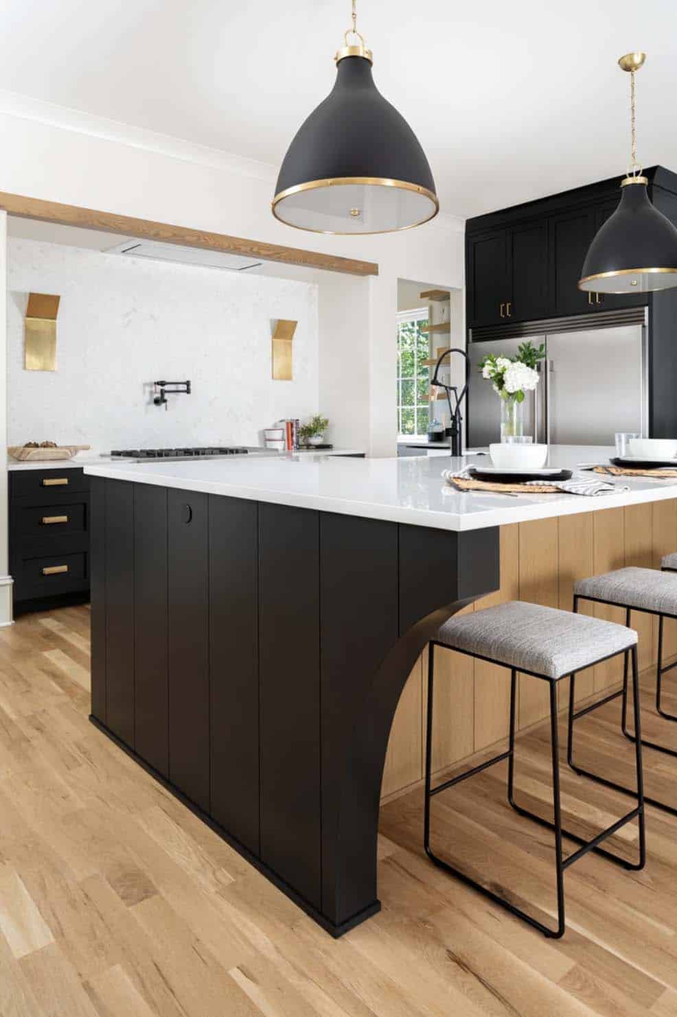 contemporary kitchen with a large island and pendant lights