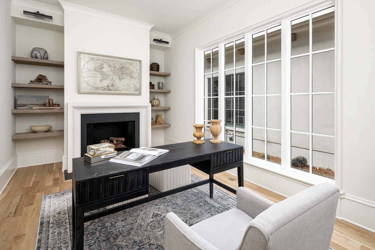 contemporary home office with a fireplace