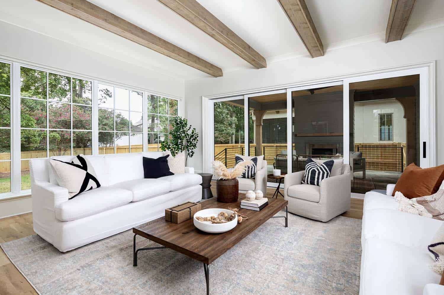 contemporary living room with wood ceiling beams
