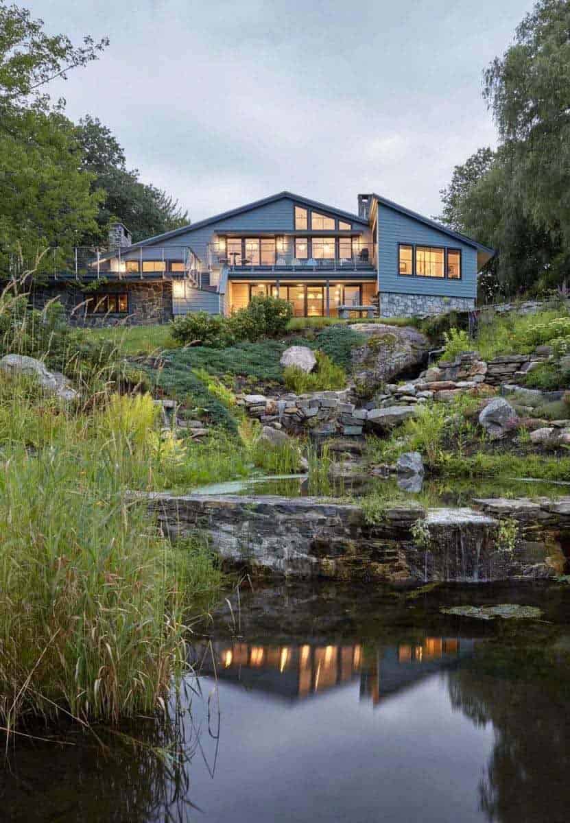midcentury modern house exterior with a waterfall view