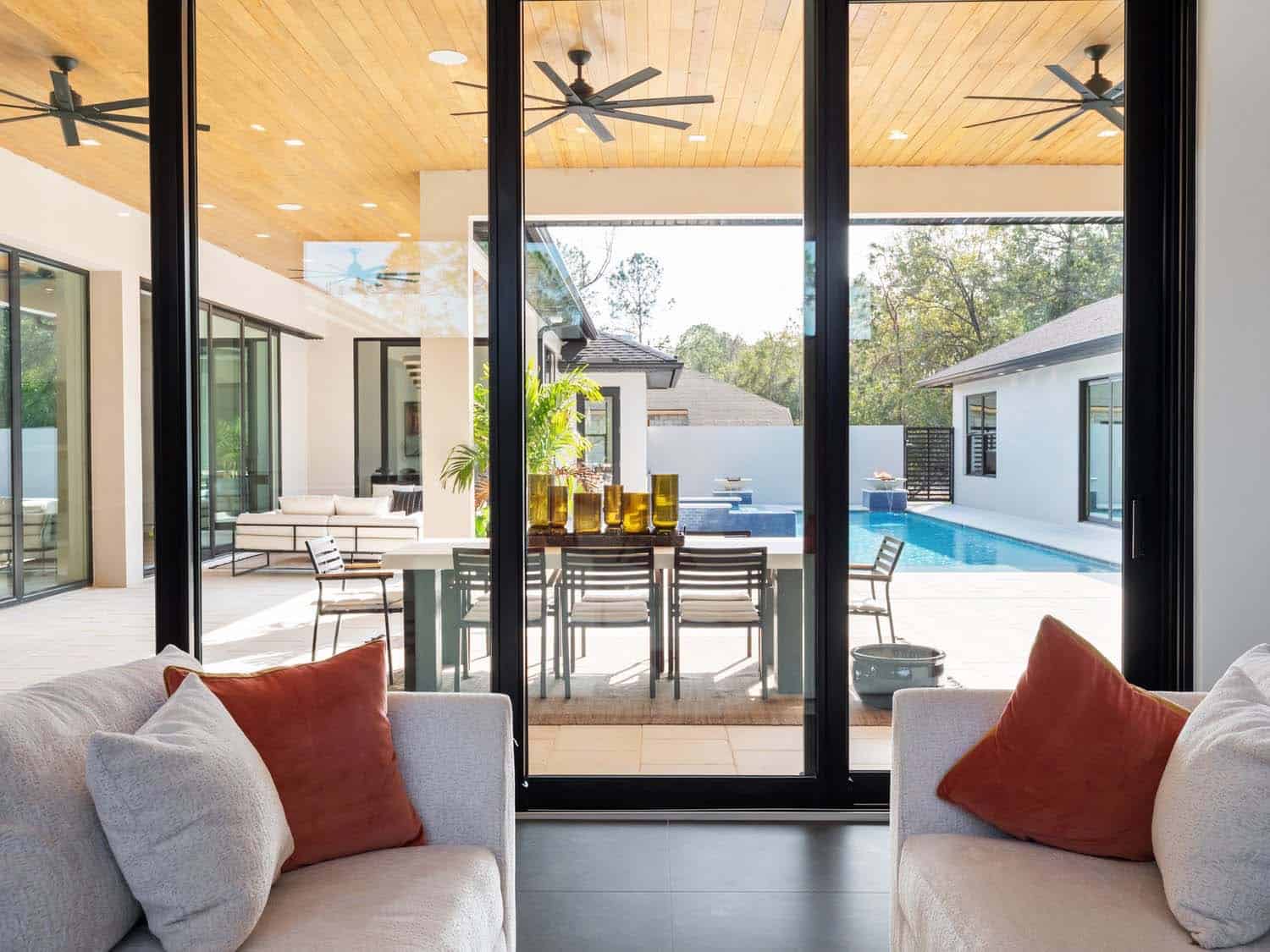 modern family room with a sliding glass door leading to a covered patio