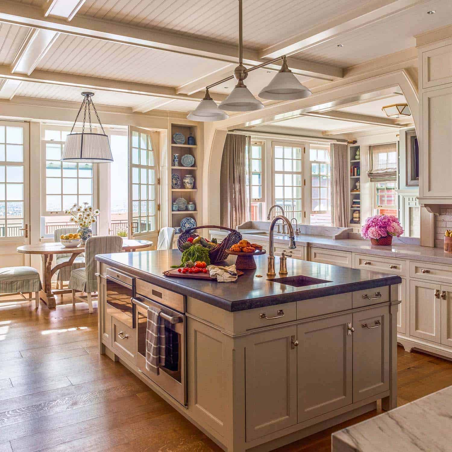 beach style kitchen island with pendant lights