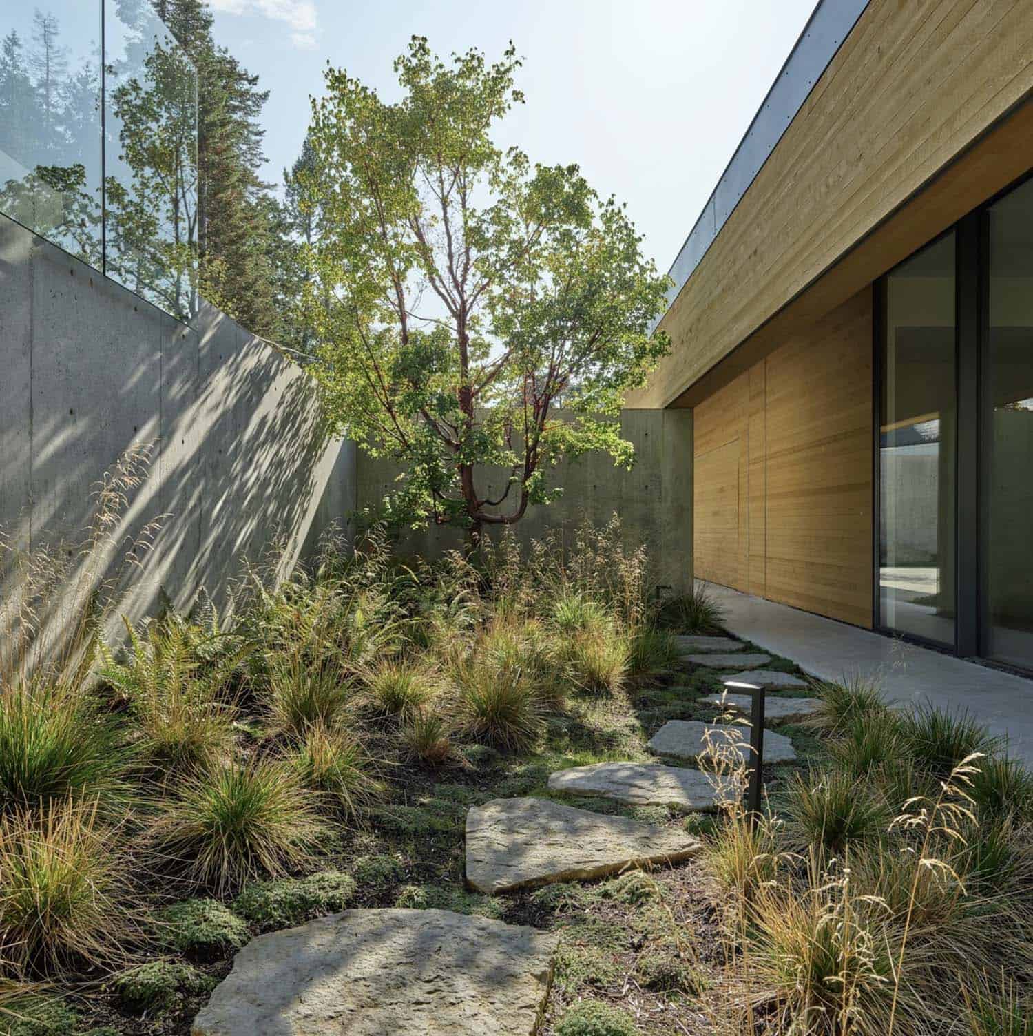 minimalist home exterior with a paver pathway