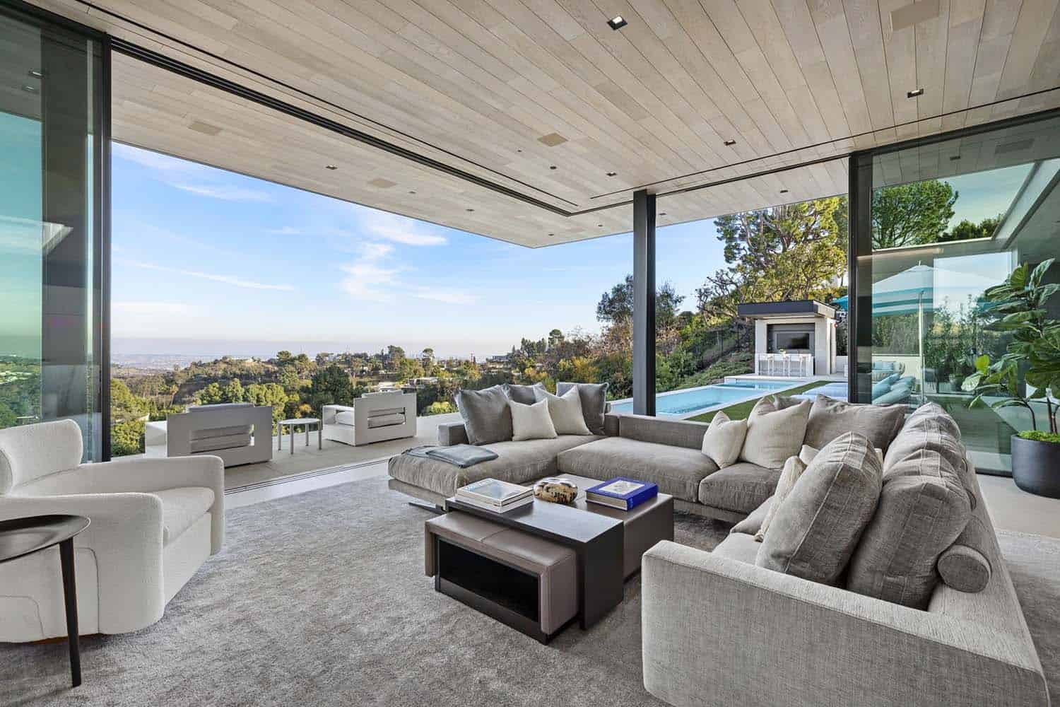 modern living room with walls of disappearing glass