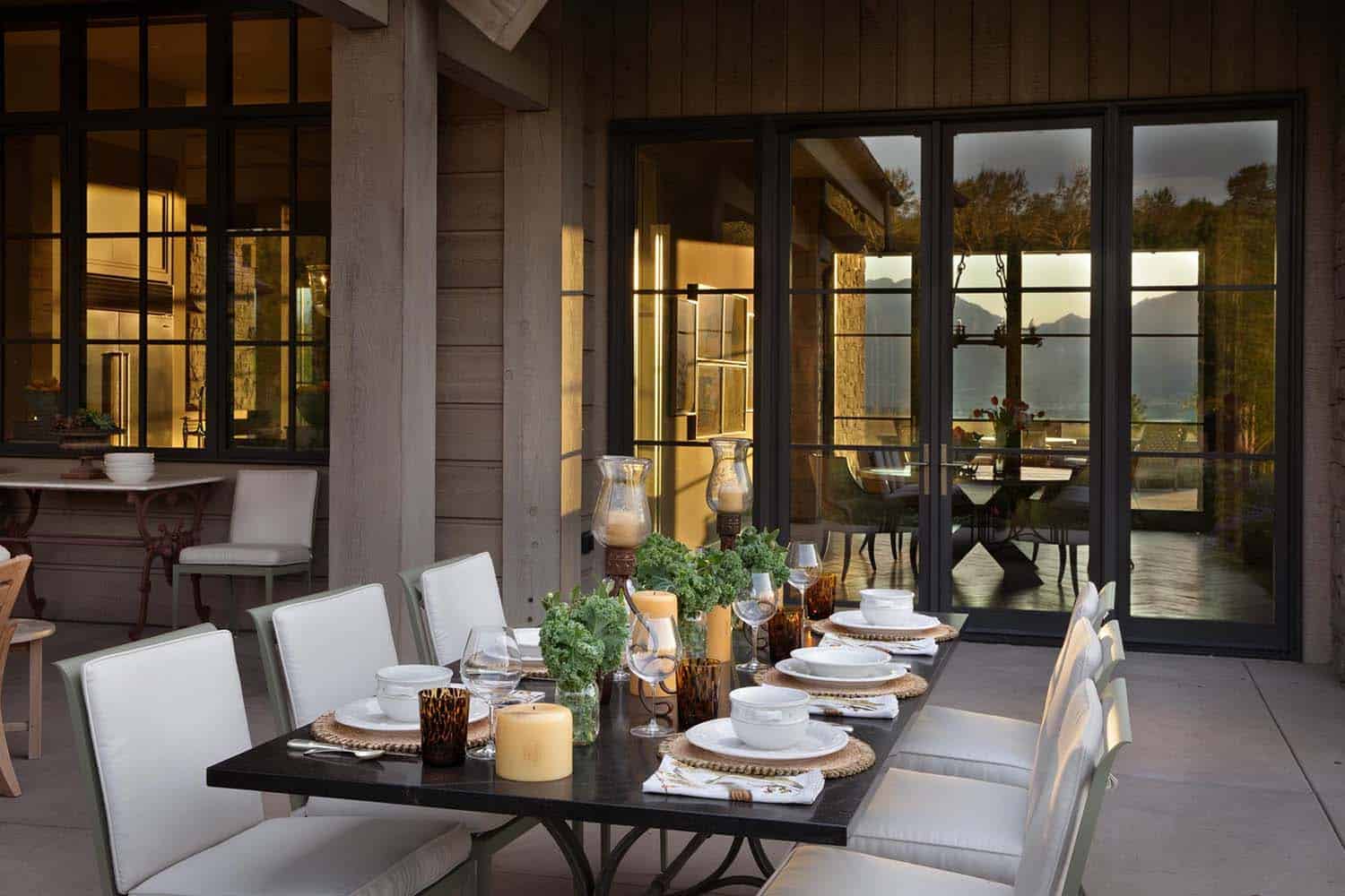rustic mountain home exterior backyard patio with outdoor dining