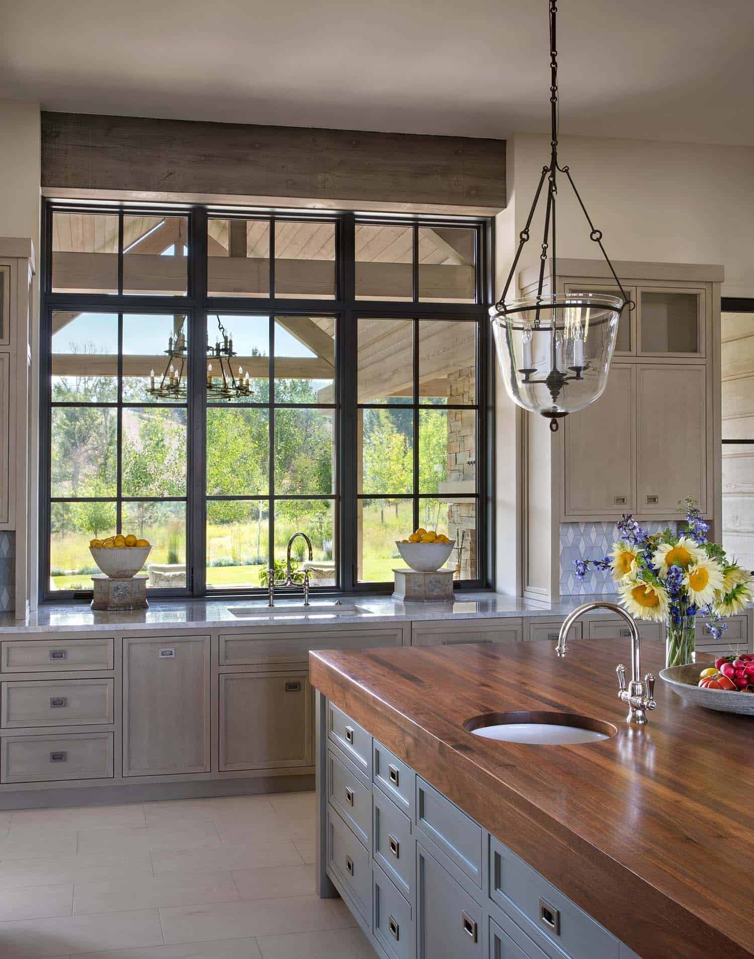 modern rustic kitchen with large pendant lights