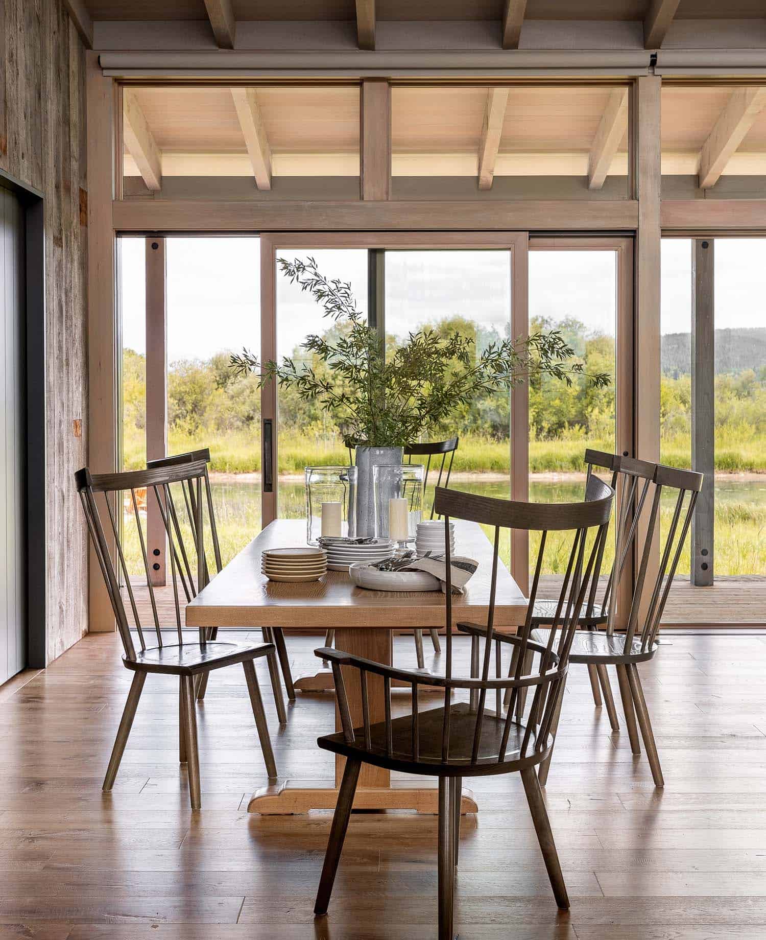 modern rustic dining room with large windows