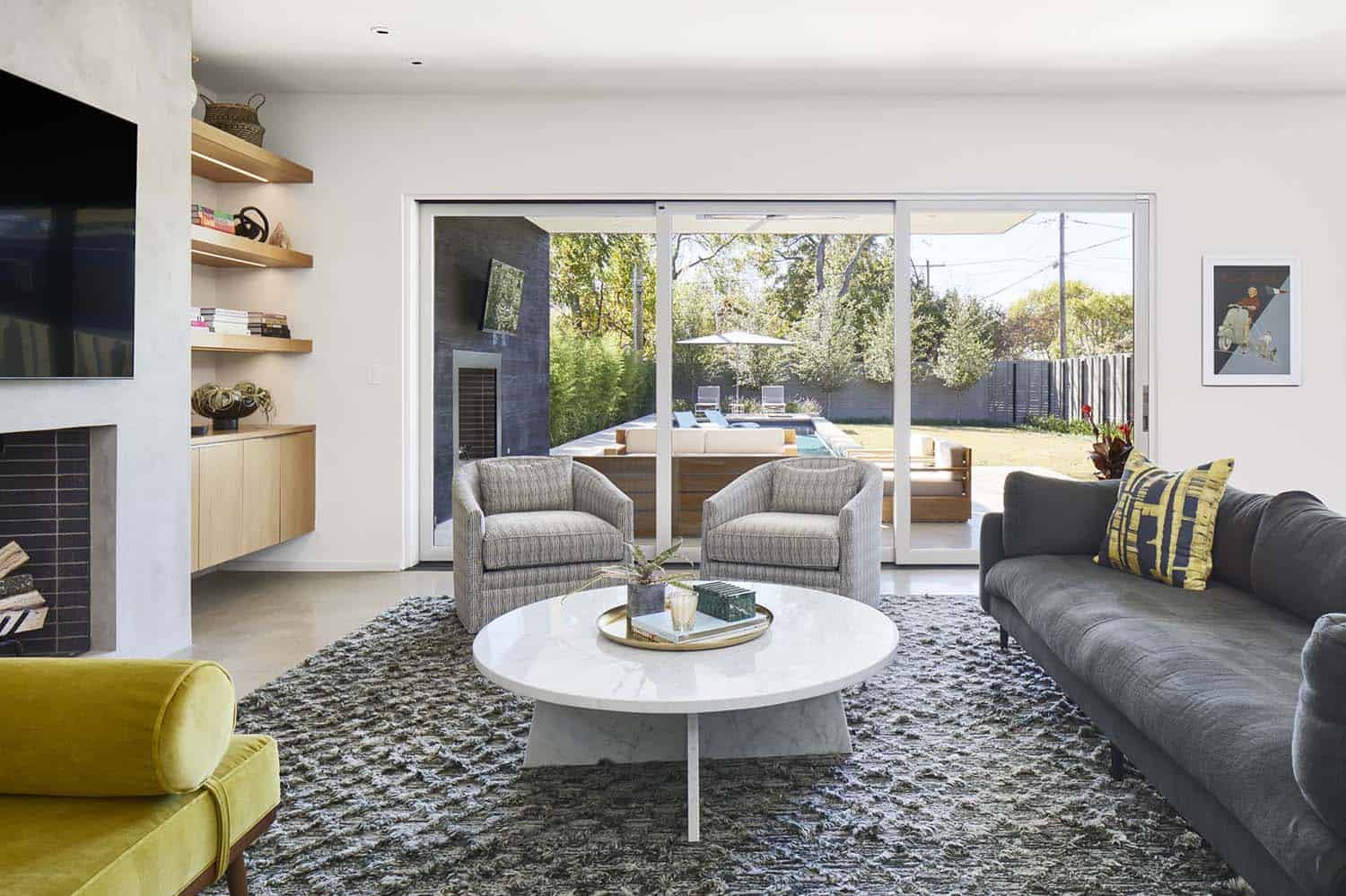 modern living room with sliding glass doors out to the patio