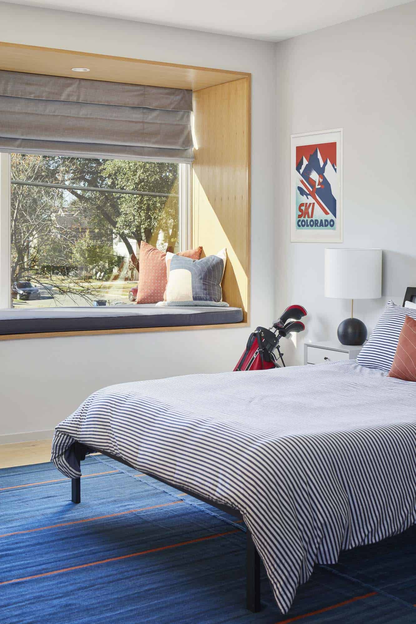 modern kids bedroom with a window seat