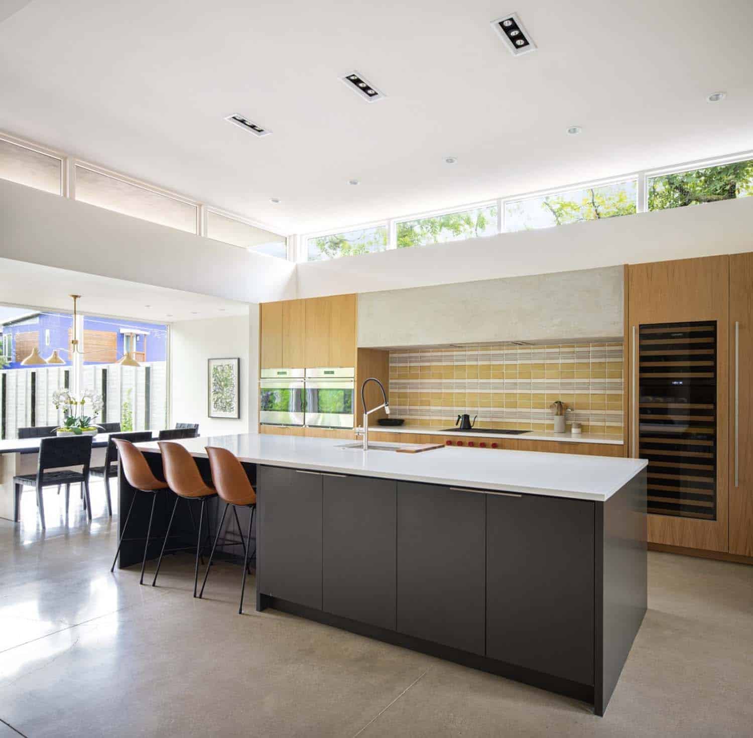modern kitchen open to the dining room