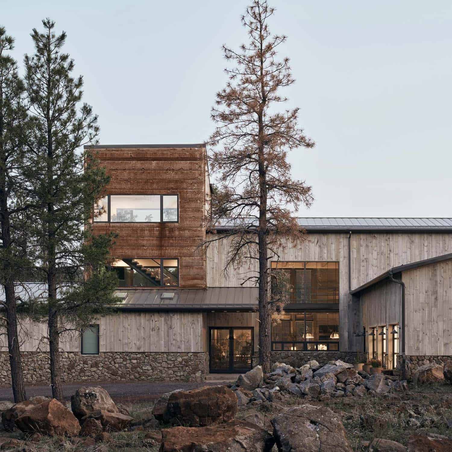 mountain modern house with a tower in a ponderosa forest