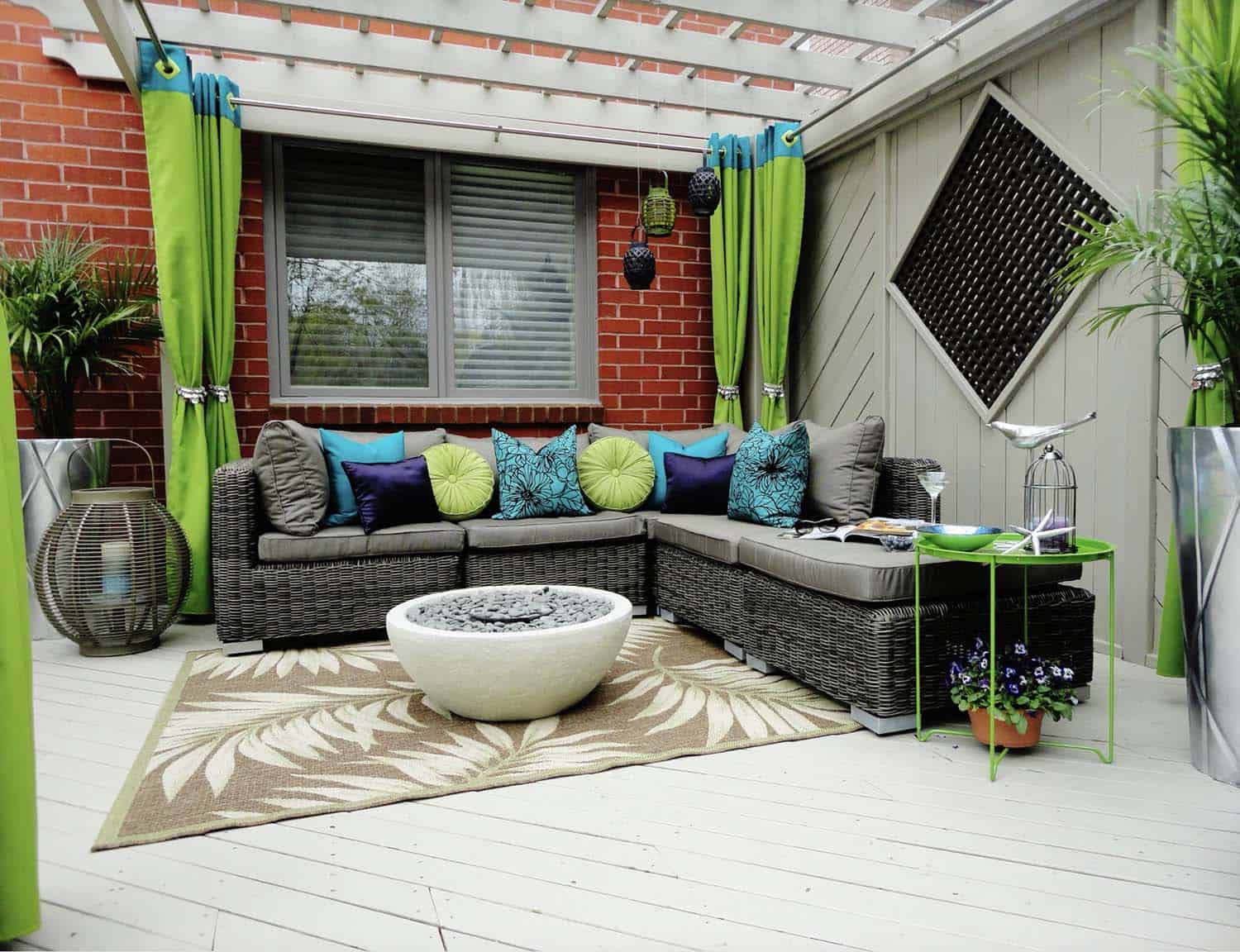 suburban outdoor hideaway with a wicker sectional and fire pit