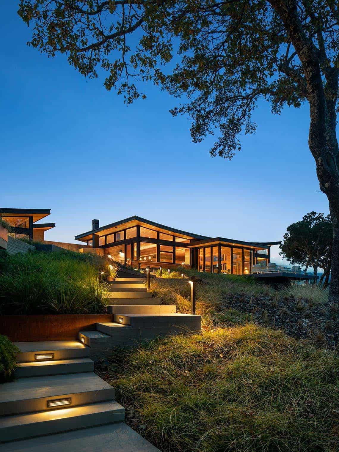 midcentury home exterior at dusk