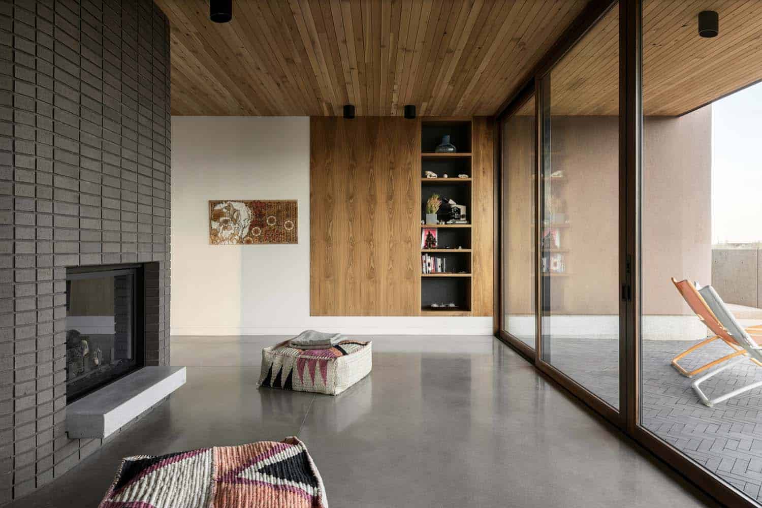 modern family room with a dual-sided fireplace