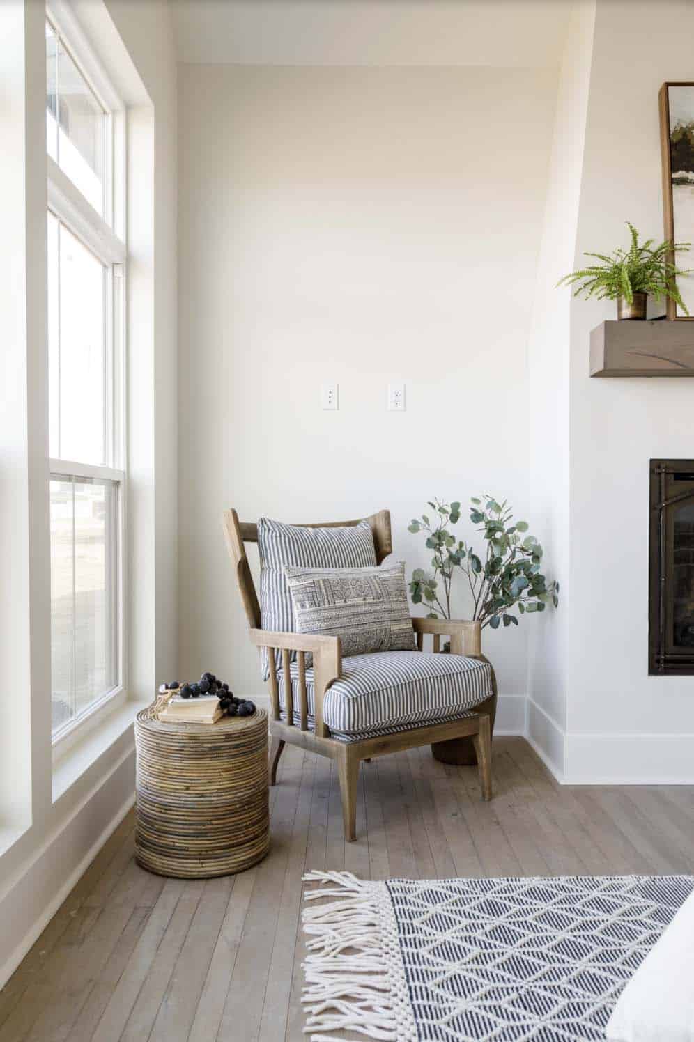 farmhouse style bedroom with a fireplace