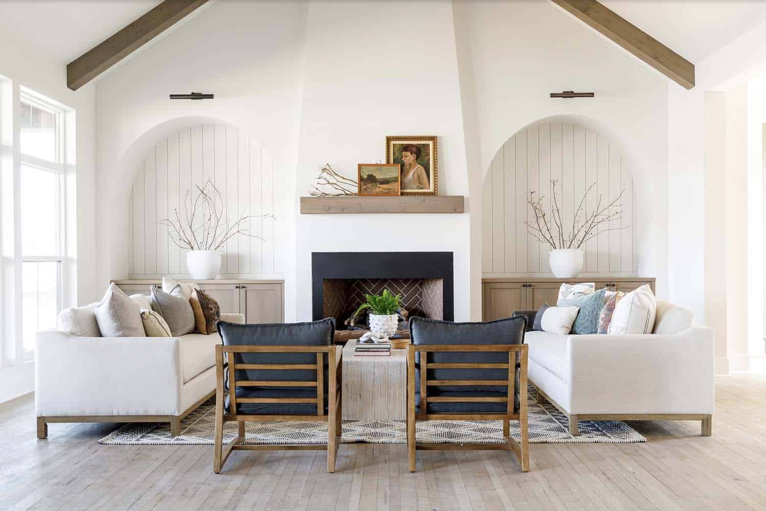 farmhouse style living room with a fireplace