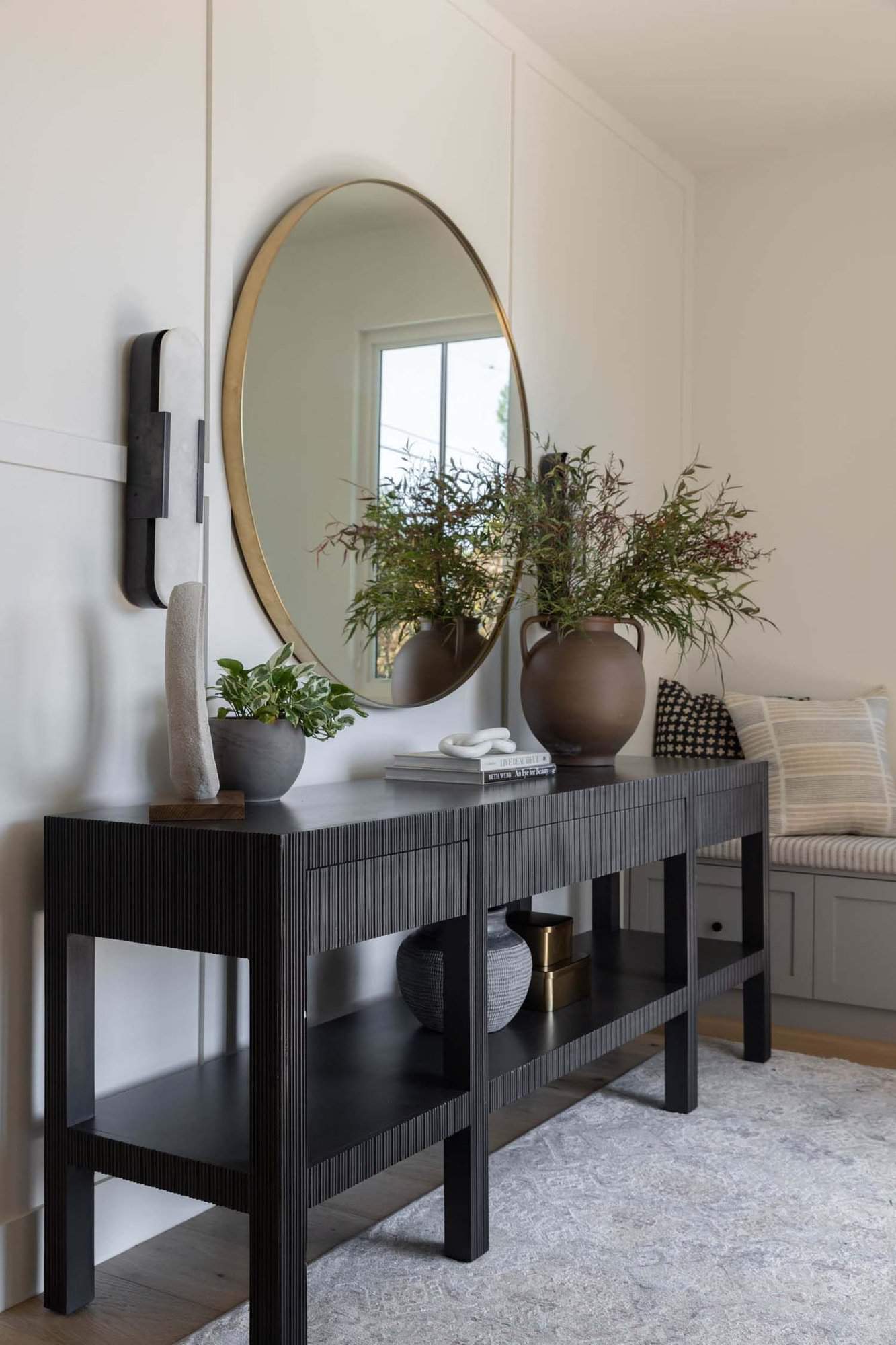 transitional style home entry with a console table