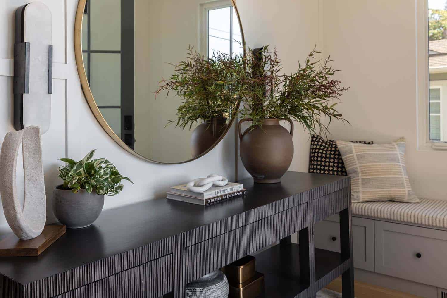 transitional style home entry with a console table
