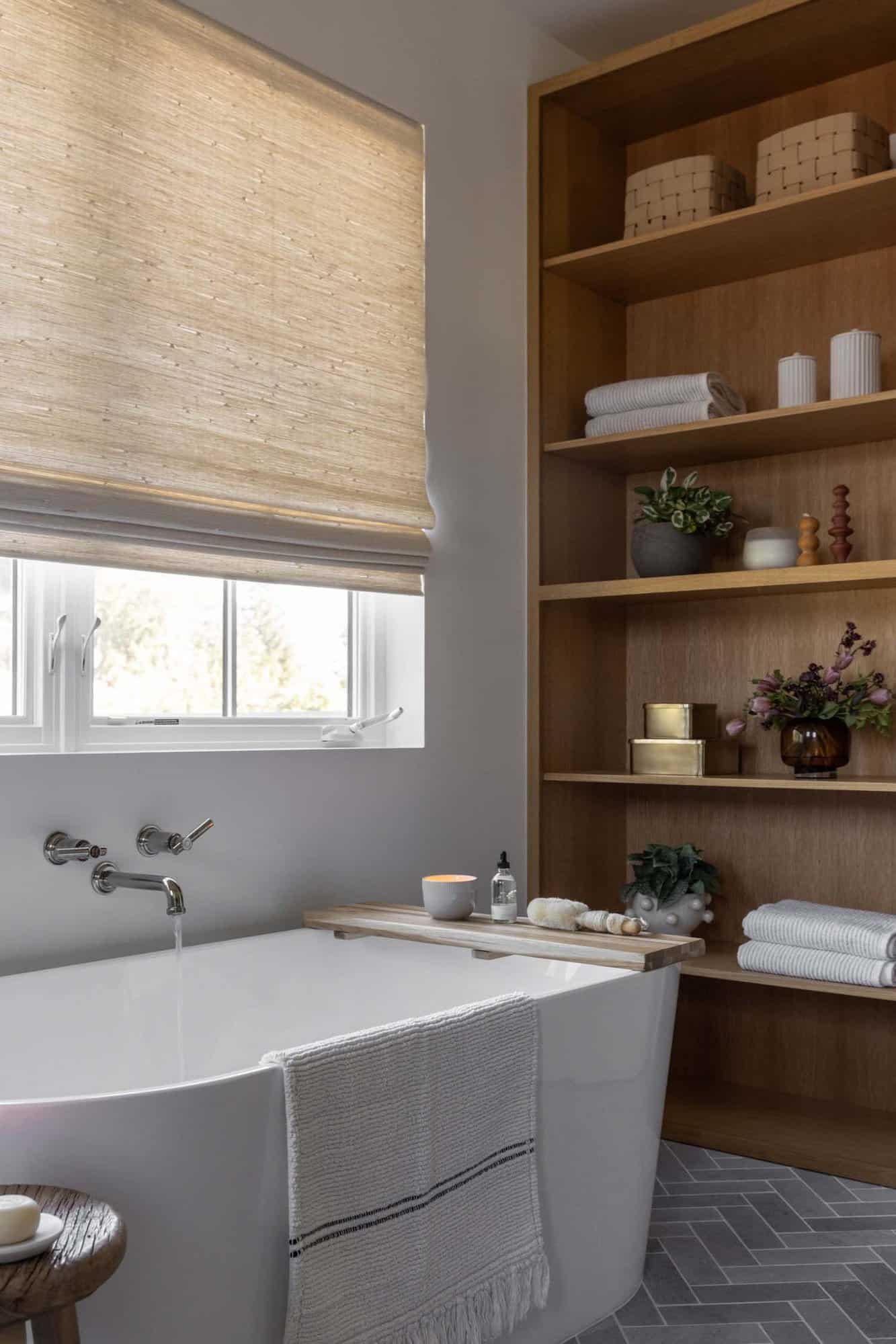 transitional style bathroom with a freestanding tub