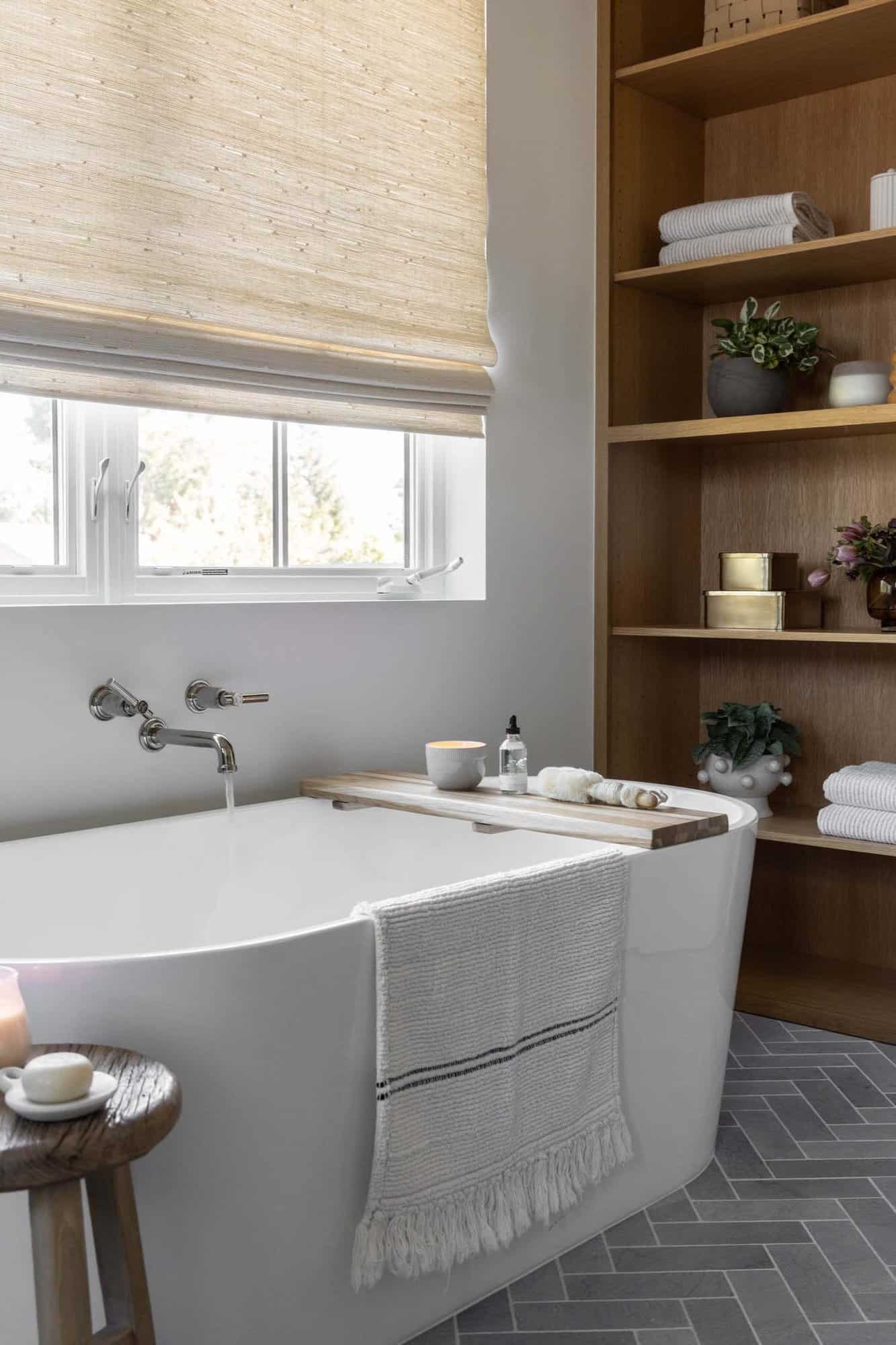 transitional style bathroom with a freestanding tub