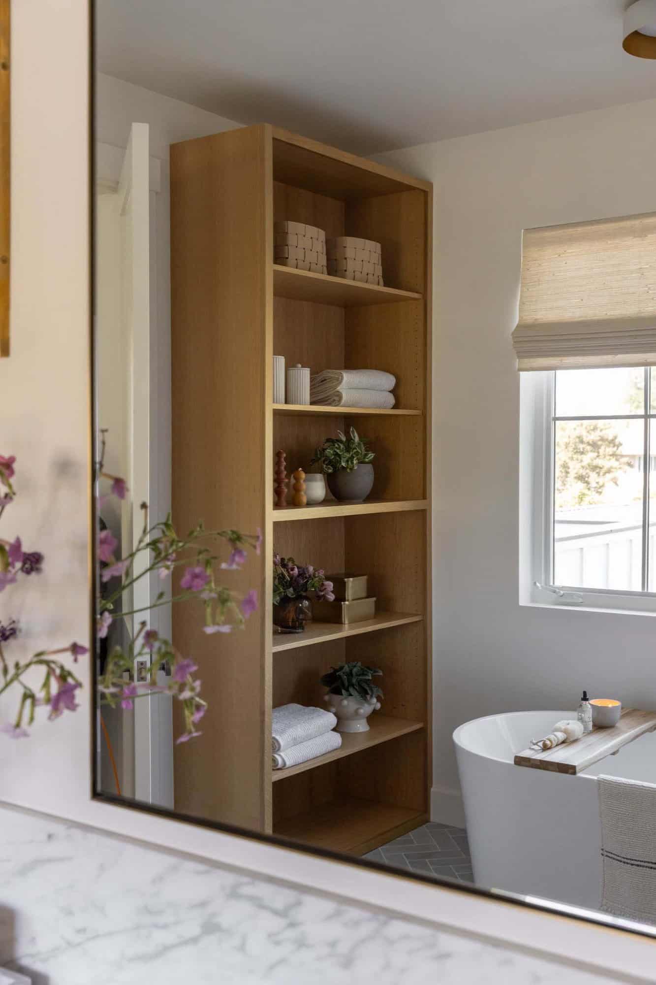 transitional style bathroom with a freestanding tub