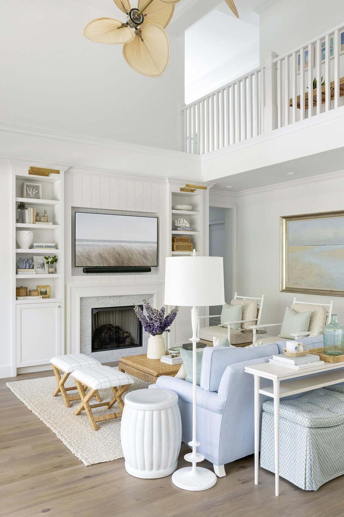 coastal style living room with a fireplace