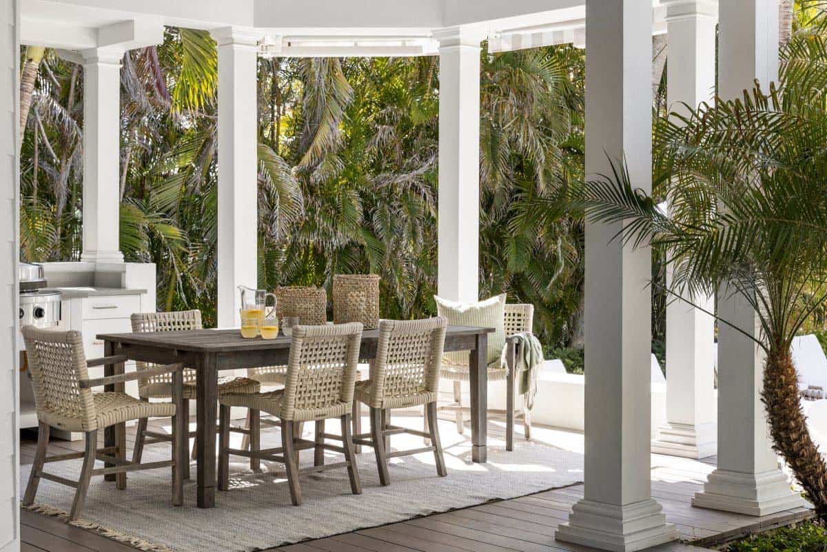 coastal style covered porch with outdoor furniture