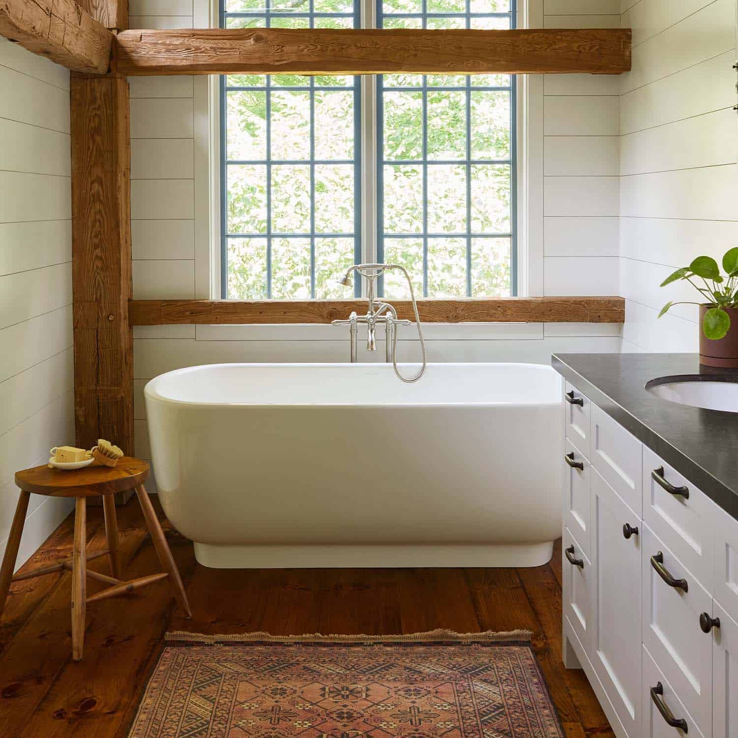 modern rustic bathroom with a freestanding tub detail