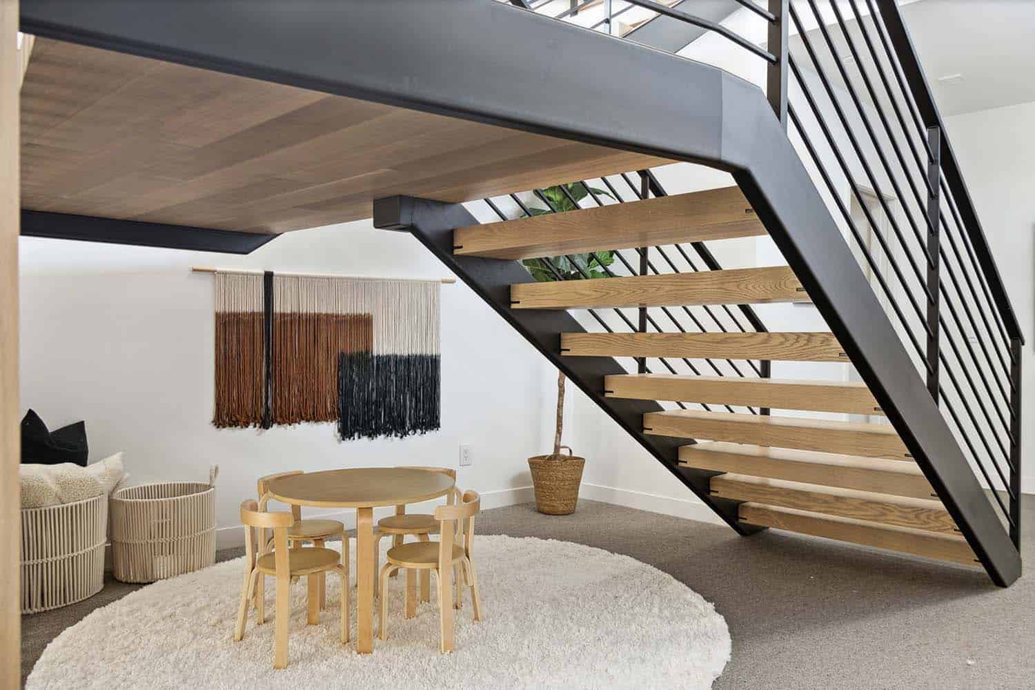 modern basement staircase with a hangout area underneath