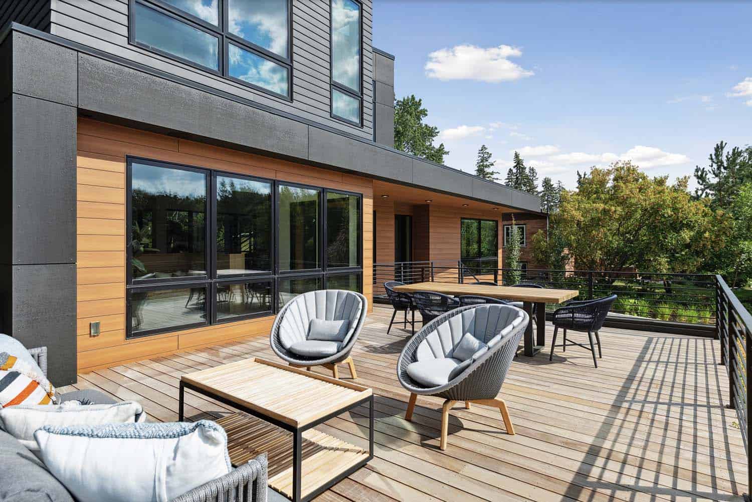 modern home with a deck and outdoor furniture