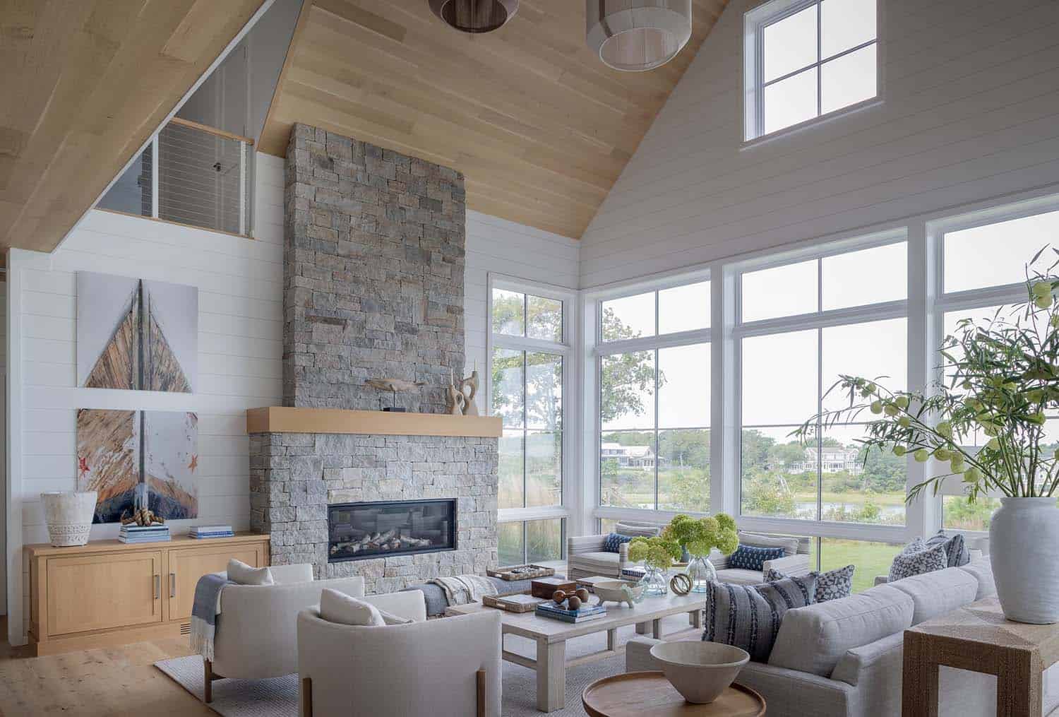 coastal style living room with a fireplace