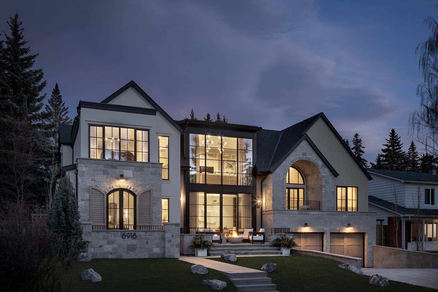 contemporary Tuscan inspired home exterior at dusk