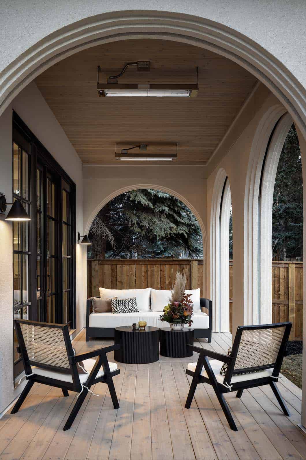 contemporary Tuscan inspired home covered porch