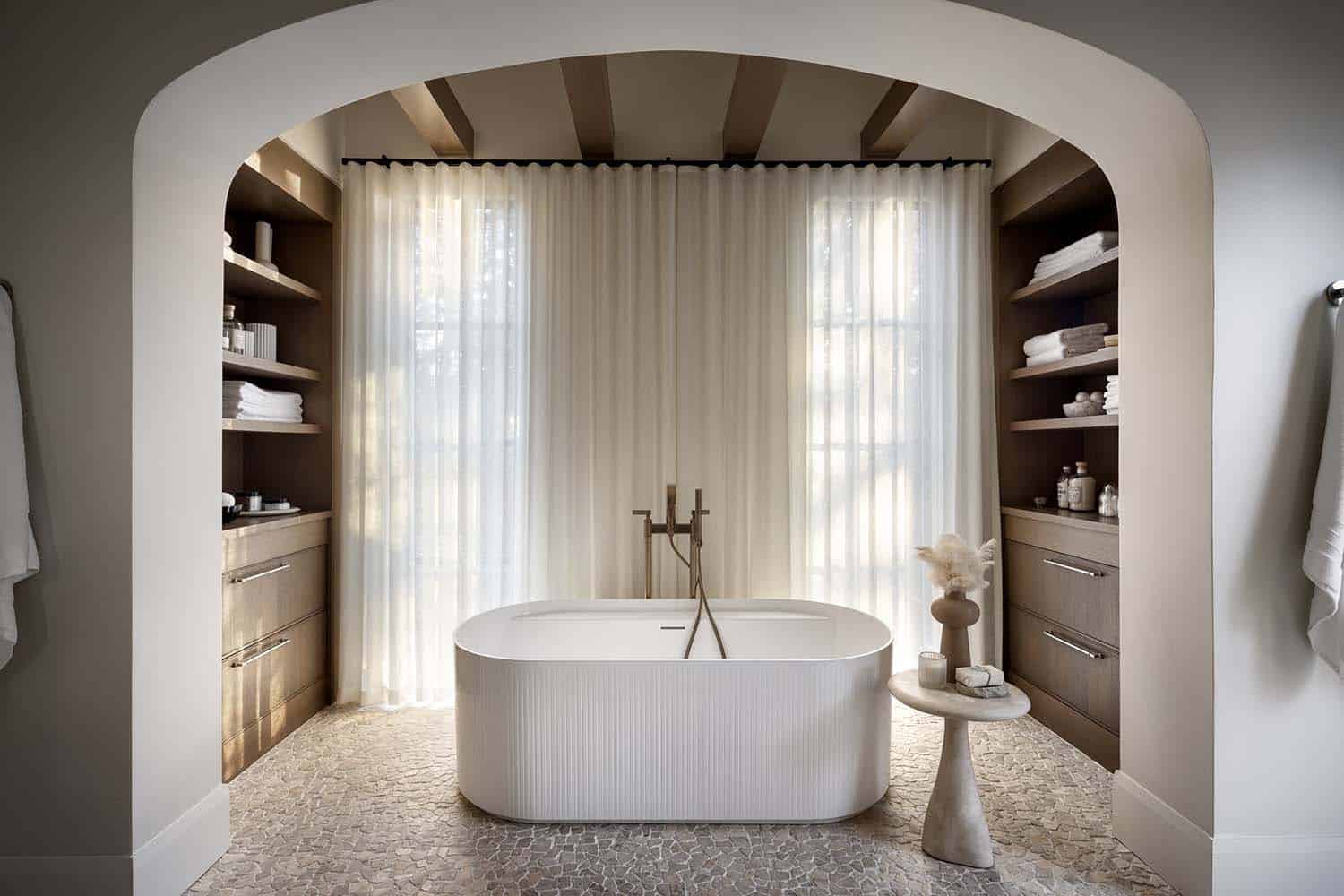 contemporary Tuscan-inspired bathroom with a freestanding tub