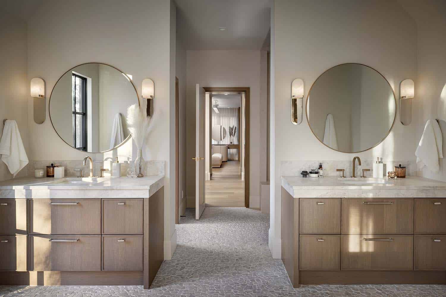 contemporary Tuscan-inspired bathroom with dual vanities