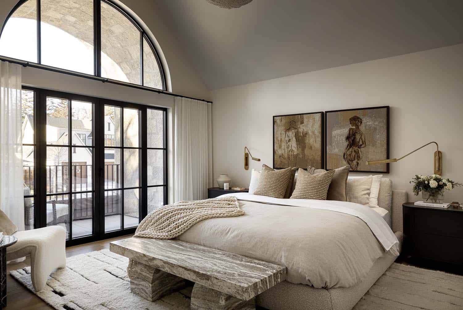 contemporary Tuscan-inspired bedroom with French doors leading out to a private balcony