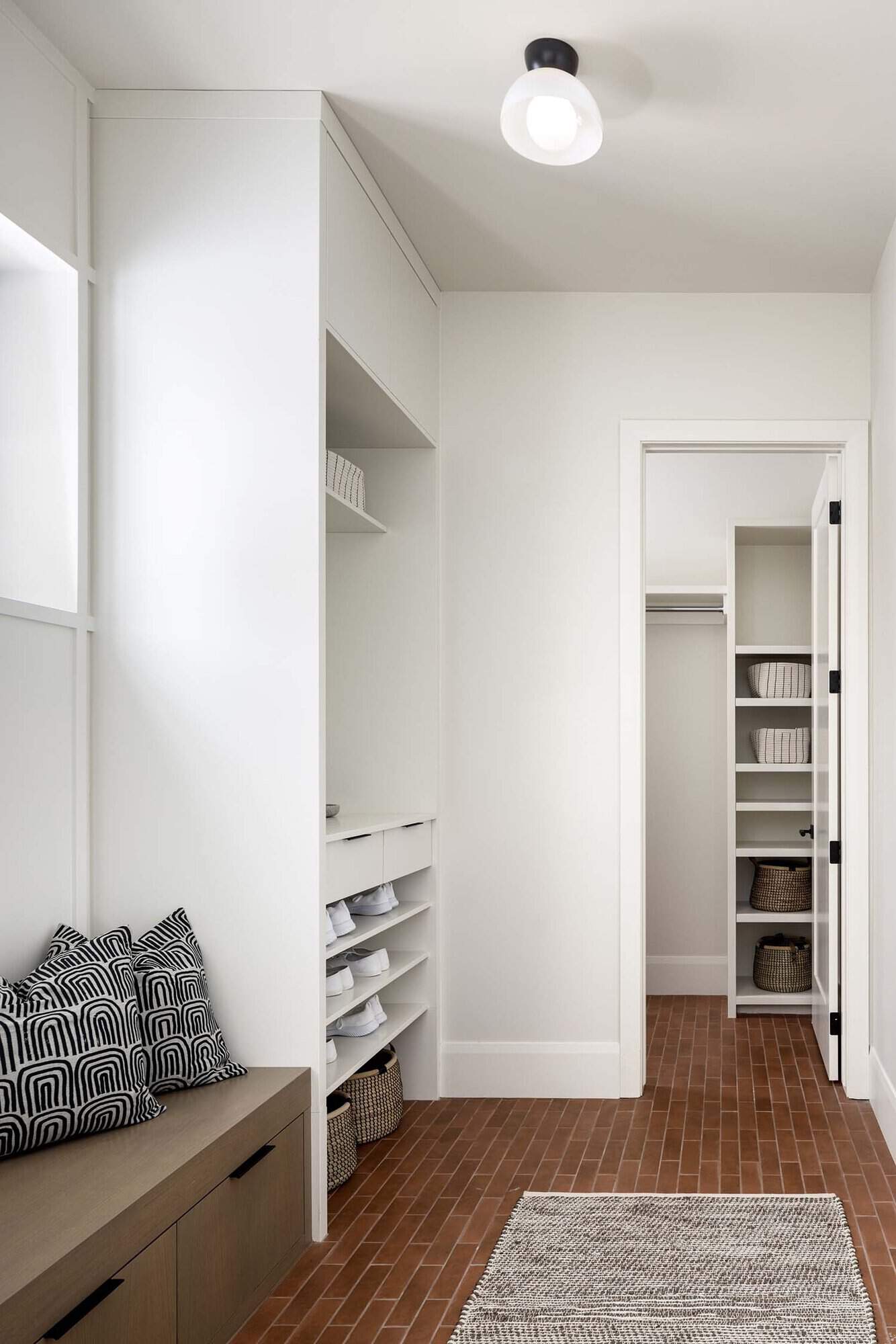 contemporary mudroom with brick flooring