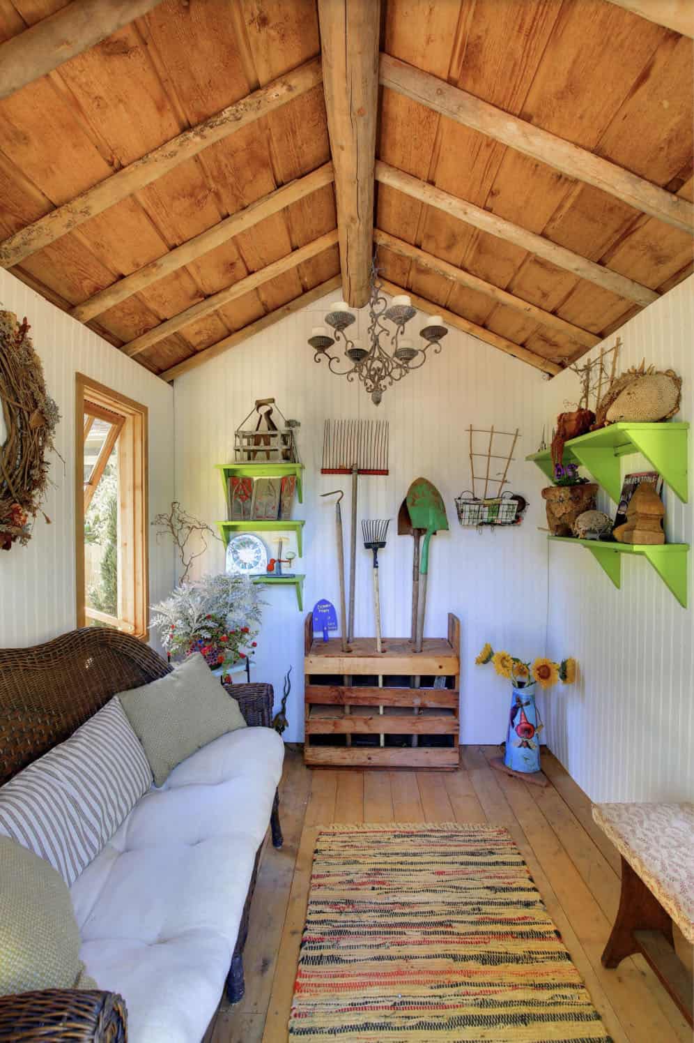 rustic shed with a wicker outdoor sofa