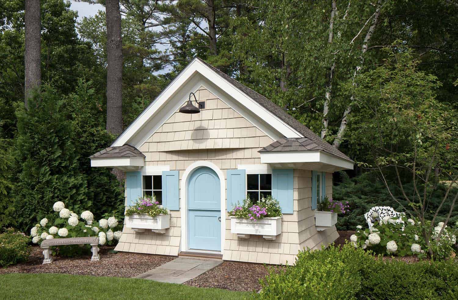 traditional shed exterior with blue shutter and a blue door