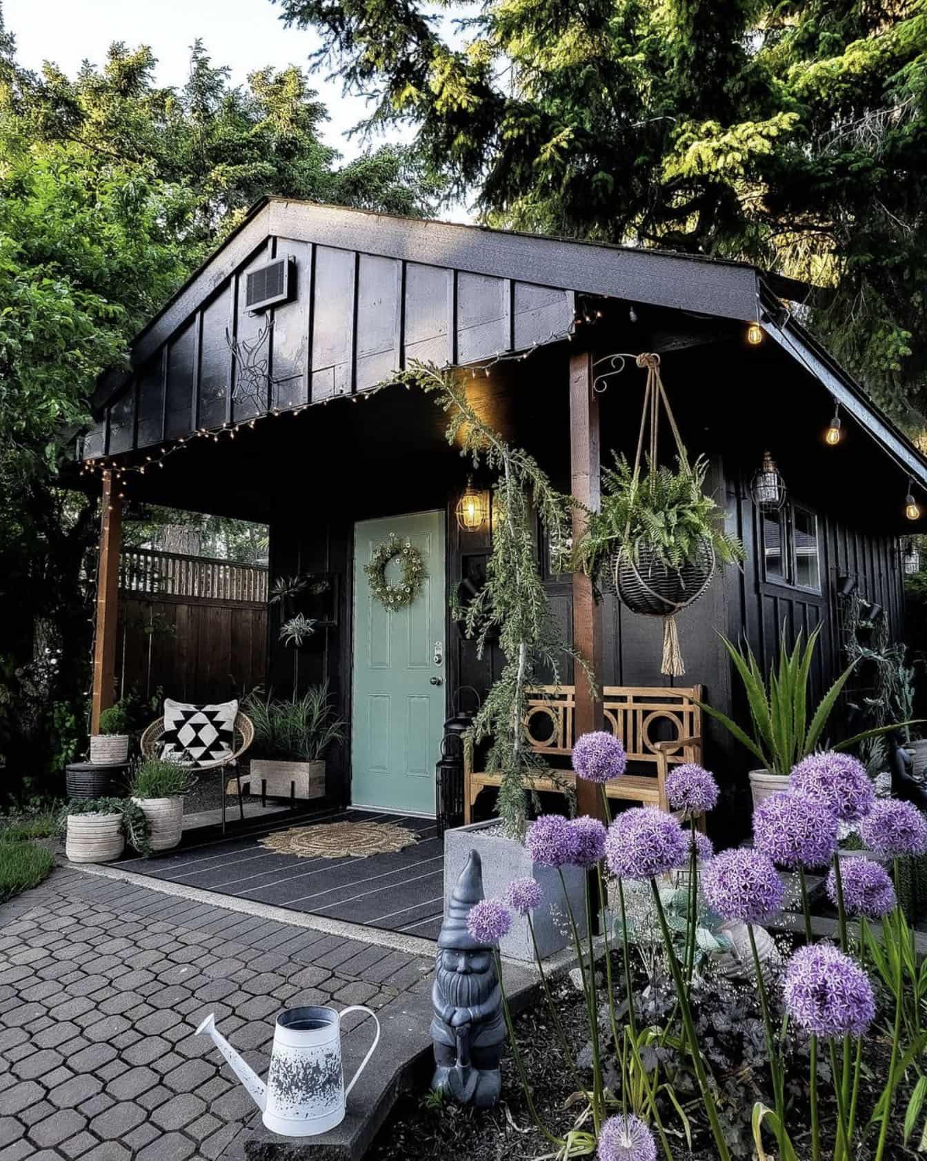 black shed with a turquoise door
