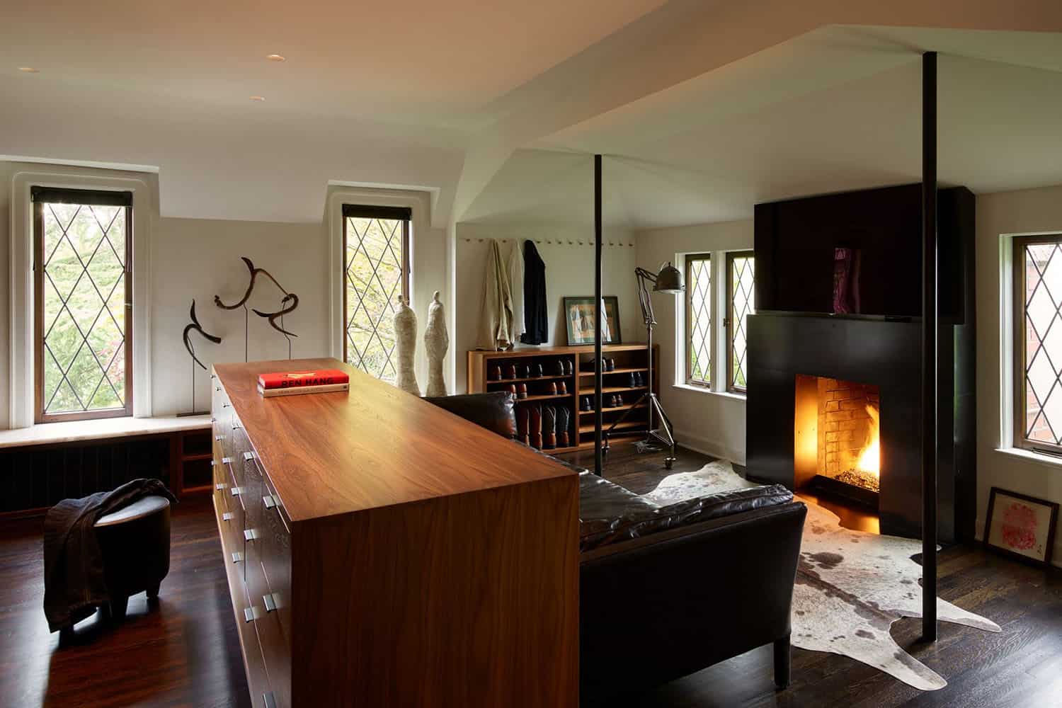 modern walk-in closet with a fireplace