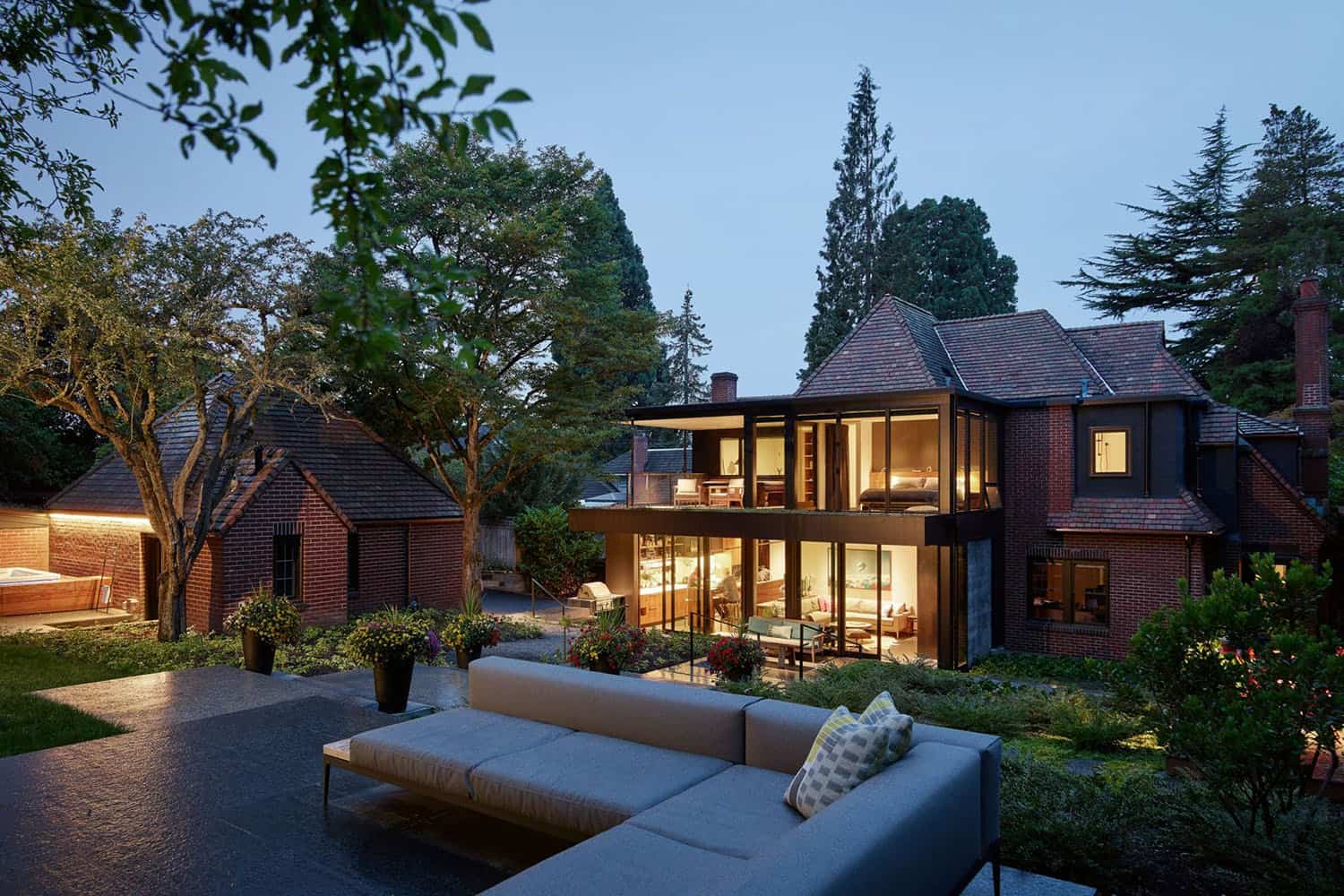 French Norman style backyard with a patio and outdoor lounge furniture