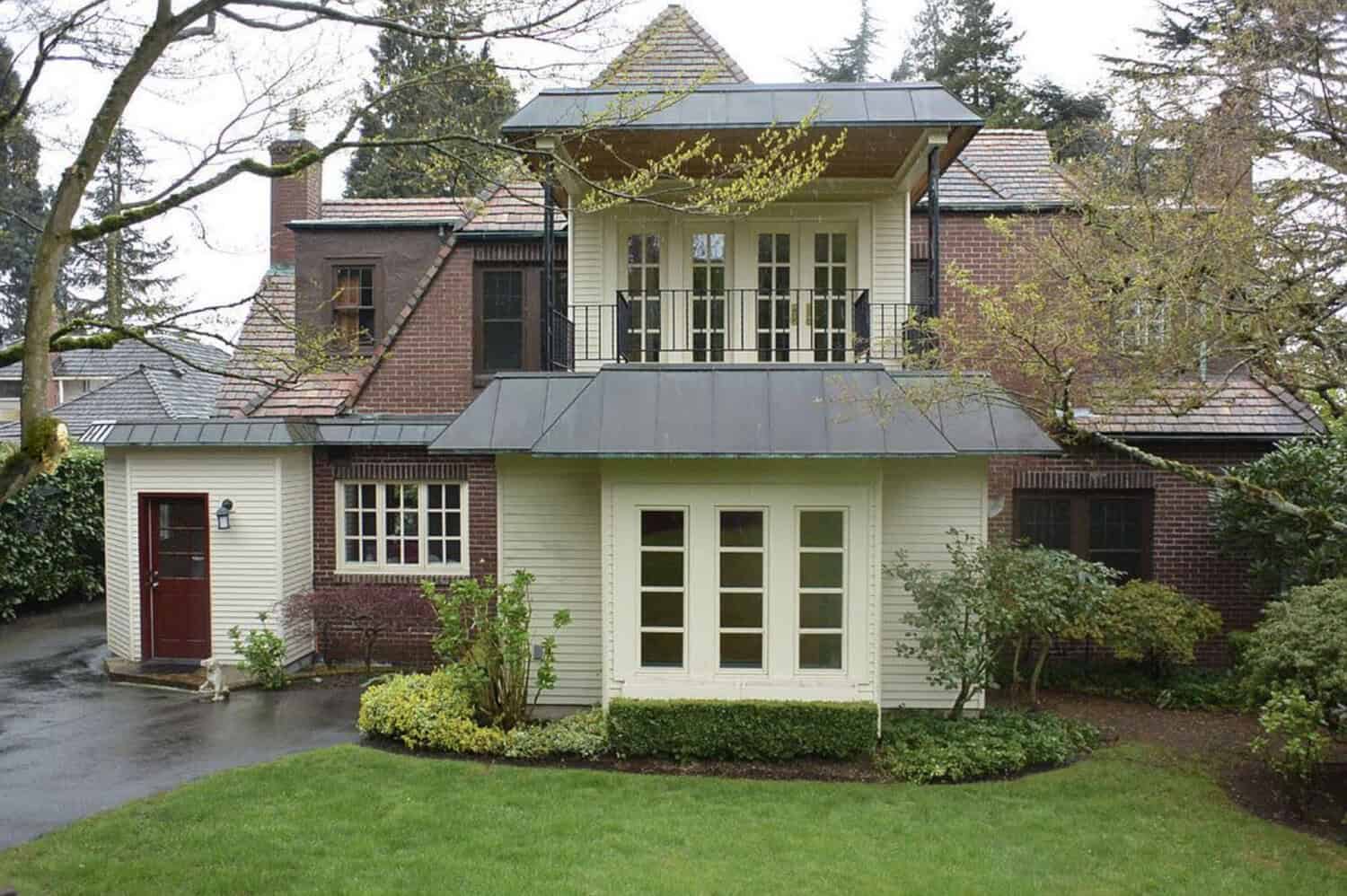 French Norman style house exterior backyard before the remodel