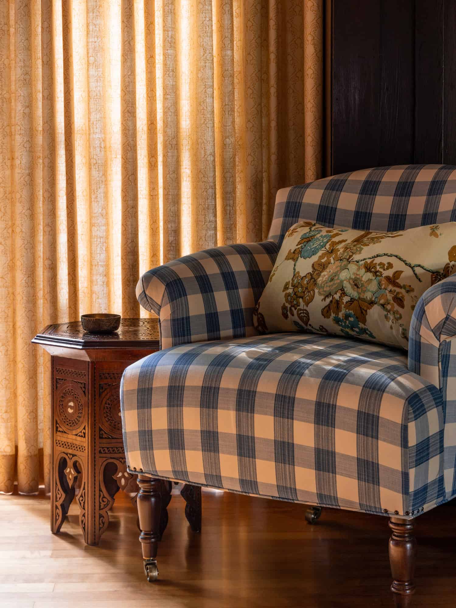 dining room with a blue and white buffalo check chair