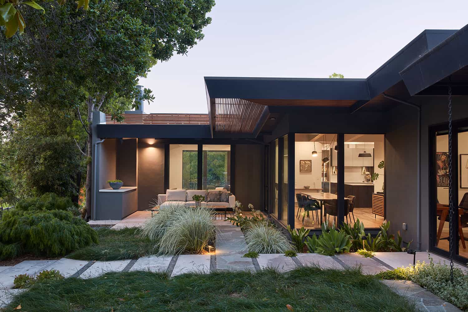 mid-century modern home exterior at dusk
