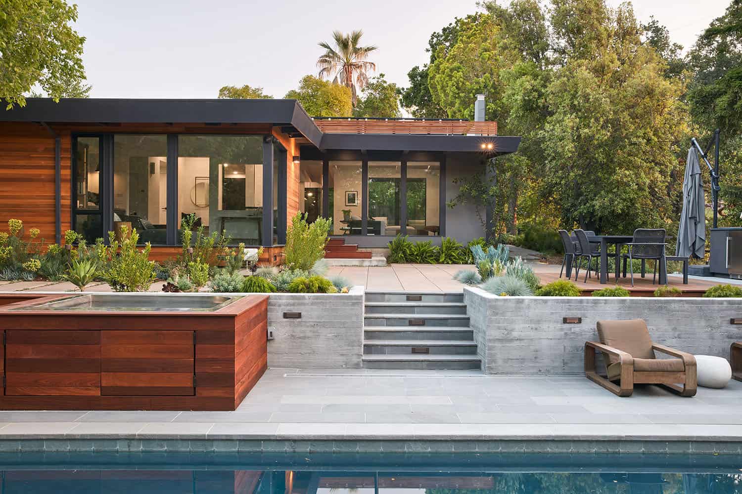 mid-century modern home exterior with a pool